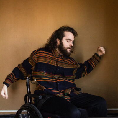 White man dancing in a wheelchair.