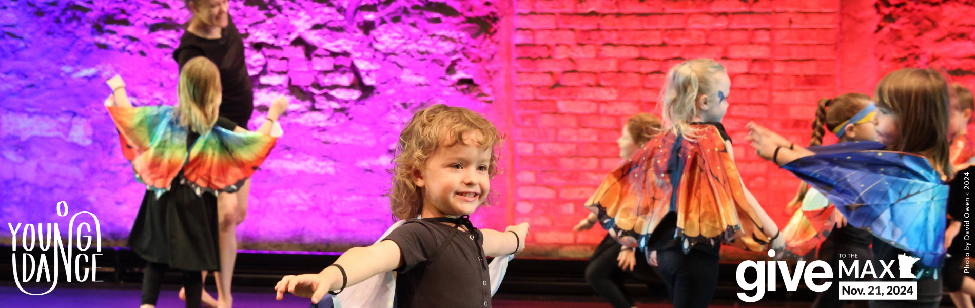 Young dancers in wings with text saying Give to the Max, November 21, 2024. 